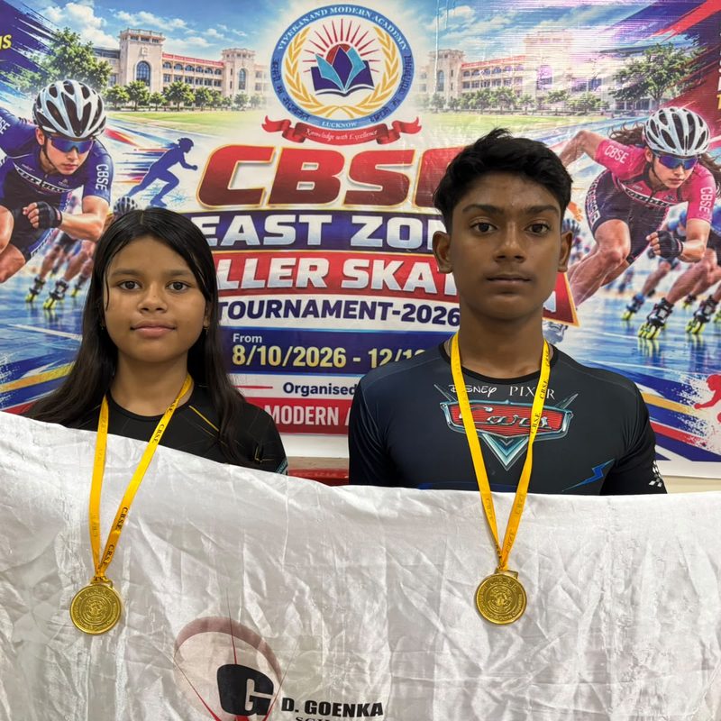 Rudransh Sharma and Prisha Ojha with their gold medals in front of the CBSE East Zone Roller Skating Tournament 2026 banner