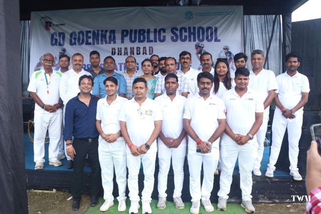 Group photo of officials and organisers in white on the stage